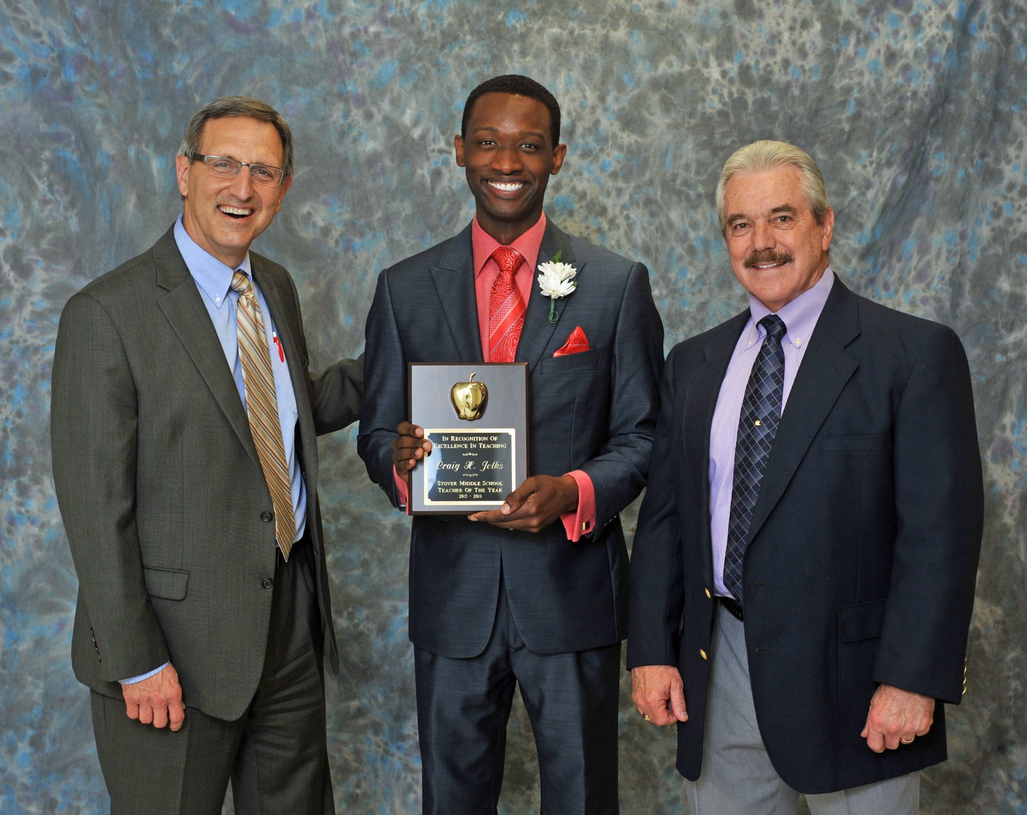 Jelks receiving an educator award